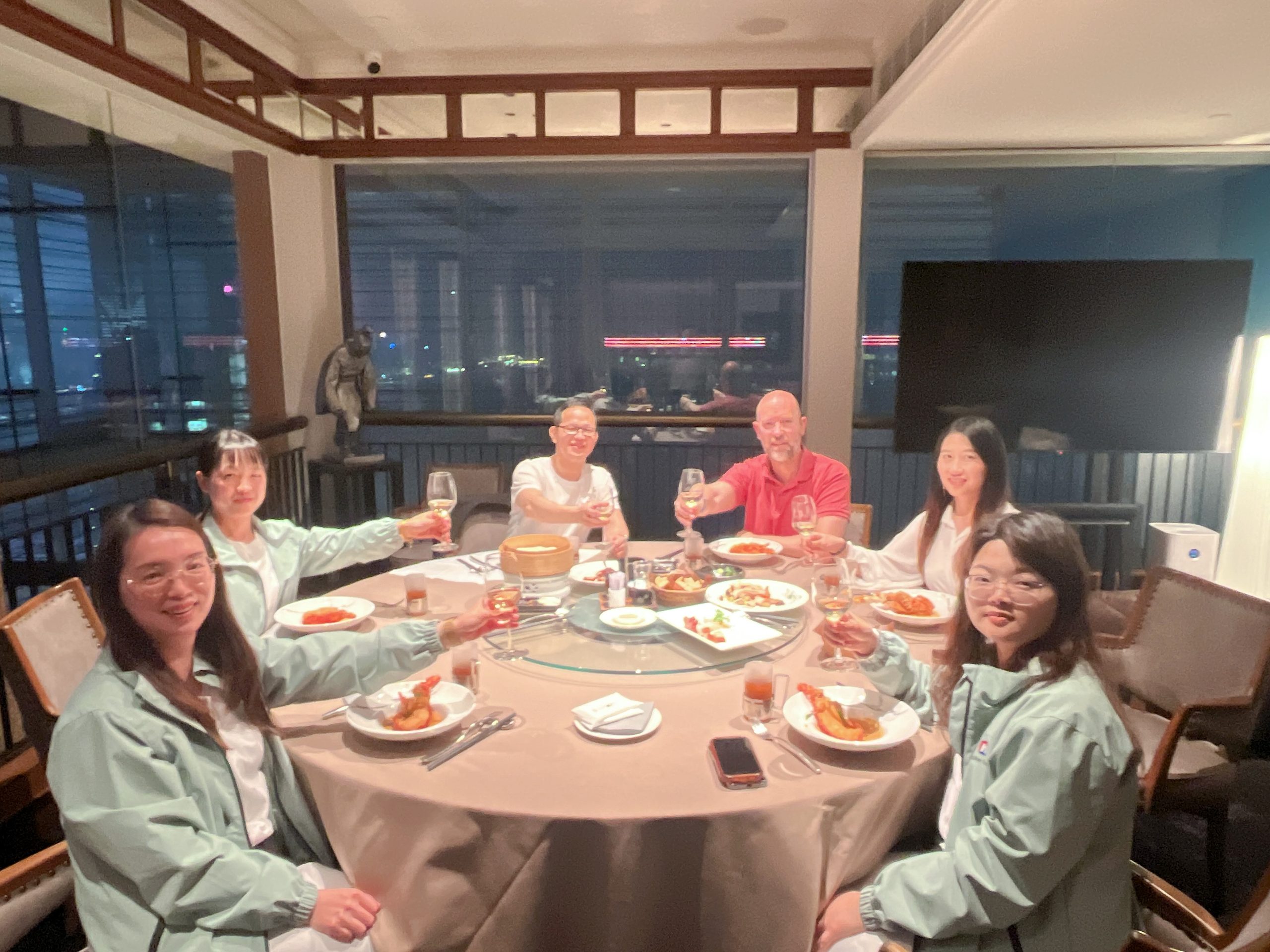 Naike Group team sharing dinner with visitors