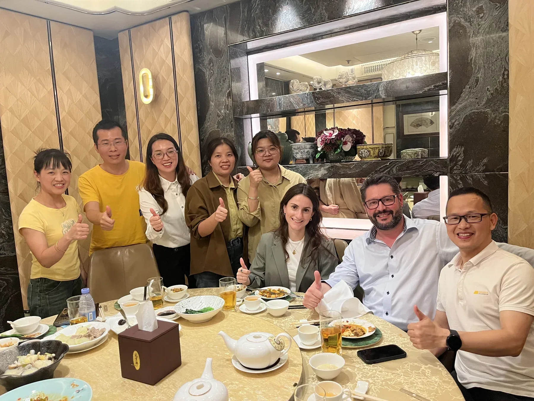 Naike Group team and international visitors at dinner